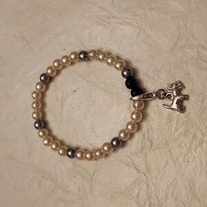 Beaded bracelet with dog charm